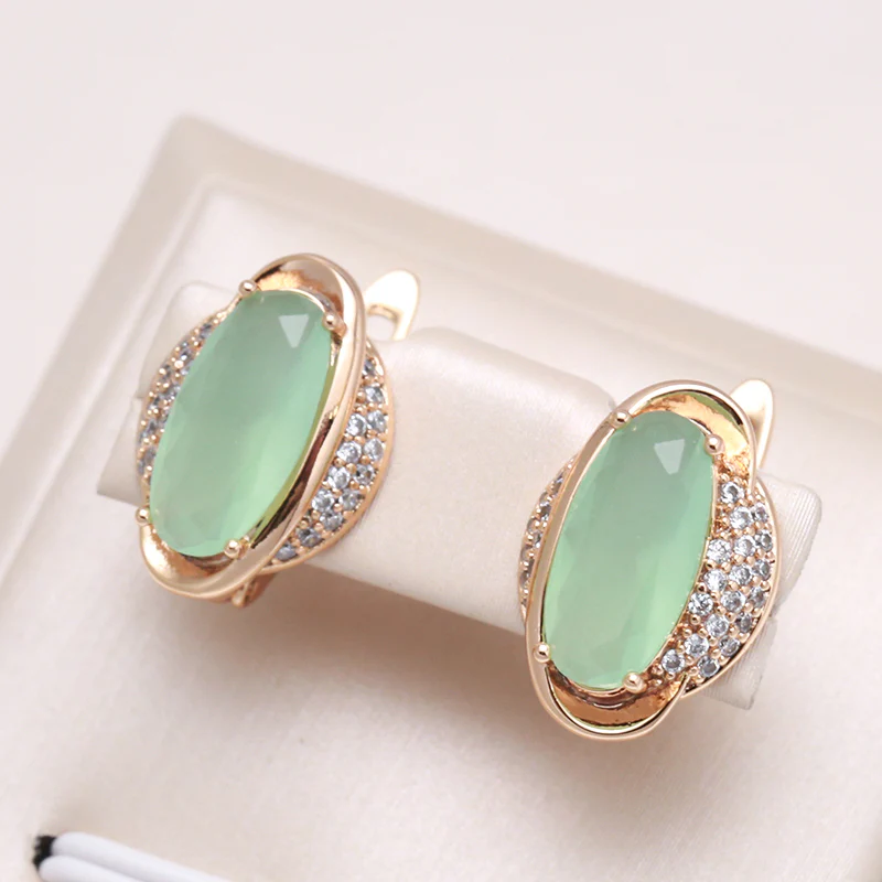 Elegante Ohrringe Grünes Kristallauge in Gold